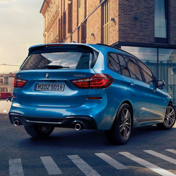 Exterior BMW 2 Series Gran Tourer Exterior BMW 2 Series Gran Tourer 220d xDrive F46 Facelift 2018 Misano Blue metallic three-quarter rear view driving downtown