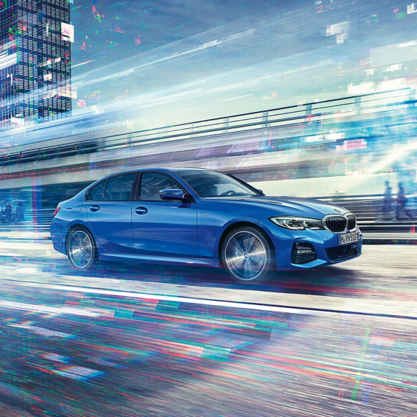 BMW 3 Series Sedan, driving side view. Driving shot of the BMW 3 Series Sedan from the side on the day in an urban setting.