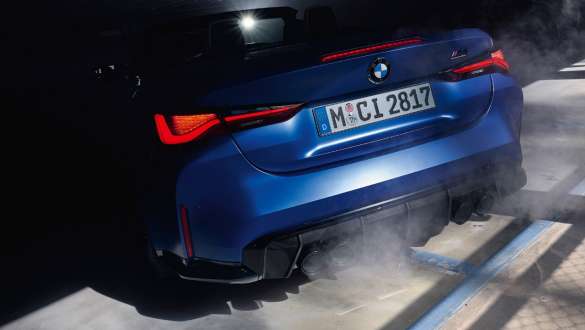 BMW M4 Competition Convertible with M xDrive G83 2021 close-up rear BMW M4 Competition Convertible with M xDrive G83 2021 BMW Individual Frozen Portimao Blue close-up rear