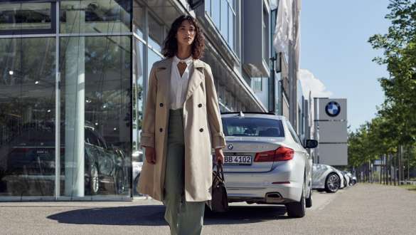 BMW Service Inclusive BMW Service Inclusive woman in front of BMW Service Center