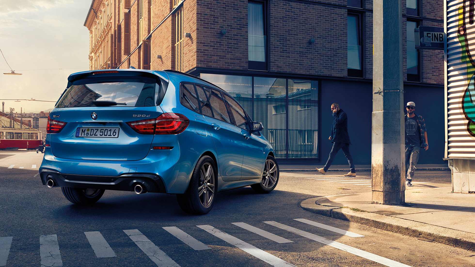Exterior BMW 2 Series Gran Tourer Exterior BMW 2 Series Gran Tourer 220d xDrive F46 Facelift 2018 Misano Blue metallic three-quarter rear view driving downtown