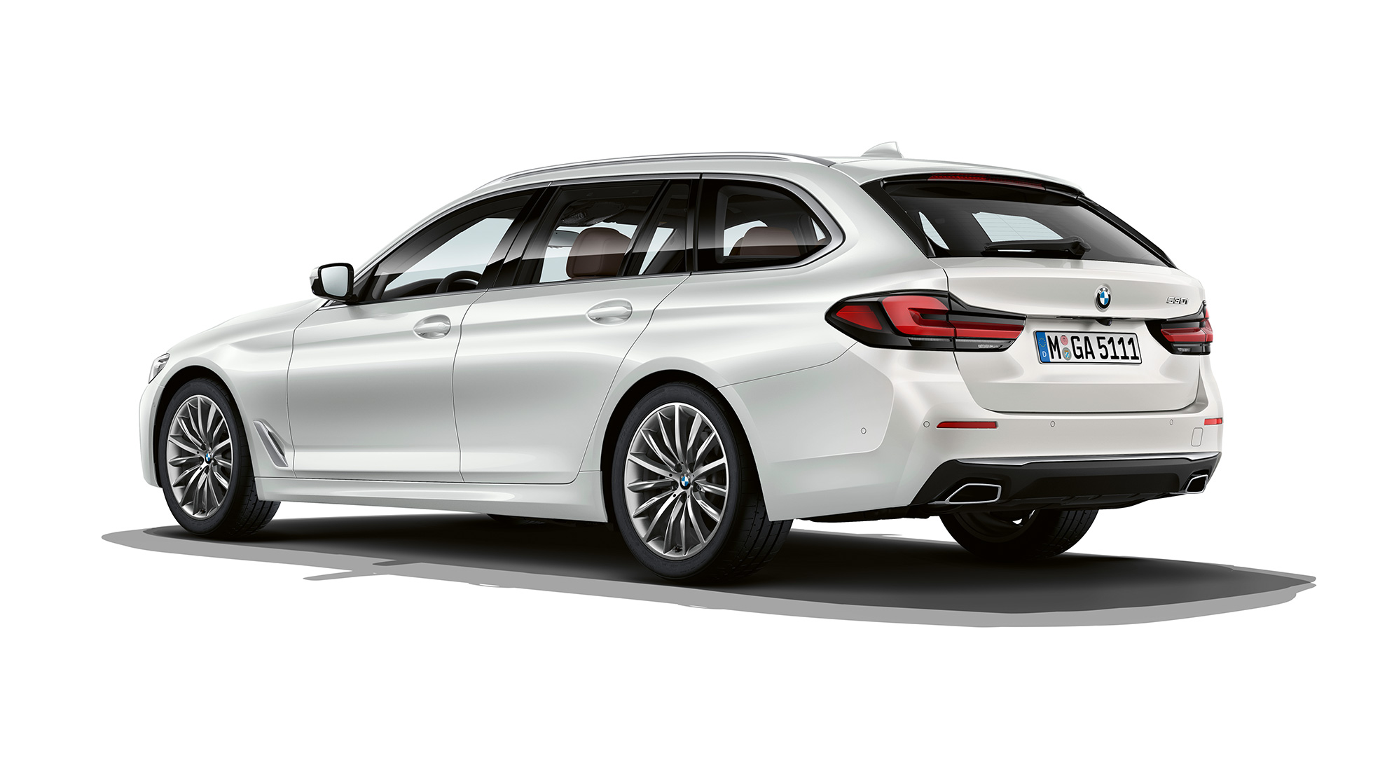 BMW 5 Series Touring G31 Luxury Line rear BMW 5 Series Touring 530i G31 2020 Luxury Line in Mineral White three-quarter rear view