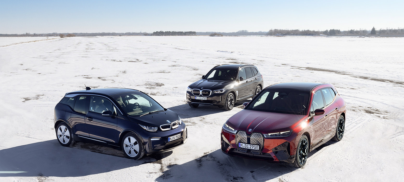BMW electric cars three-quarter side view on sand bird's eye view BMW i Series BMW electric cars three-quarter side view on sand bird's eye view