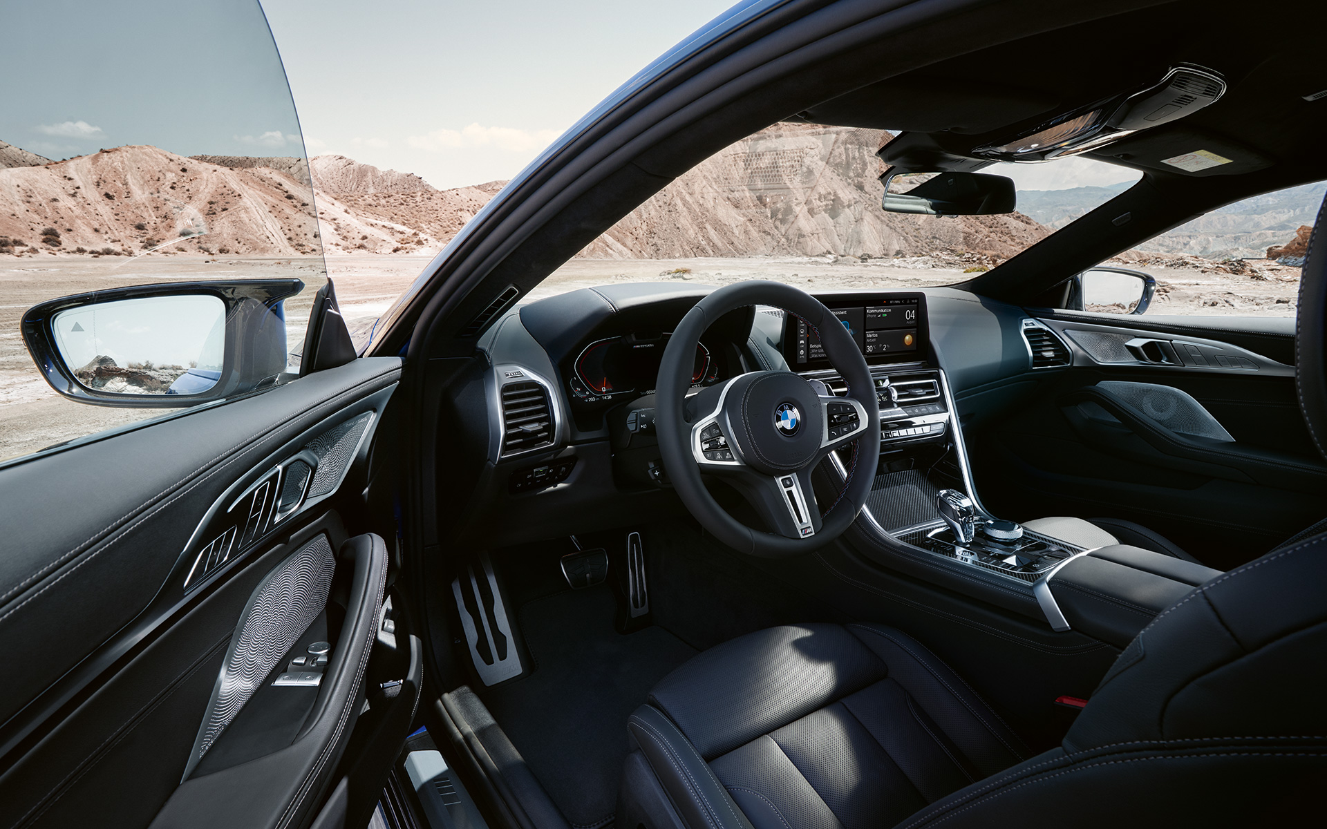 BMW M850i xDrive Coupé G15 LCI Facelift 2022 Driver-oriented cockpit with M leather steering wheel BMW M850i xDrive Coupé G15 LCI Facelift 2022 Driver-oriented cockpit with M leather steering wheel with open front door