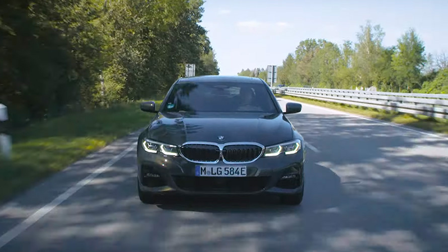 BMW G20 plug-in hybrid driving on the street BMW G20 plug-in hybrid driving on the street front view