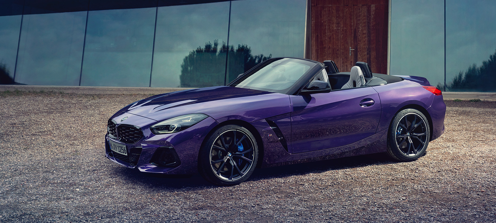 BMW Z4 M40i Roadster (G29) three-quarter side view driving BMW Z4 M40i Roadster (G29) three-quarter side view driving