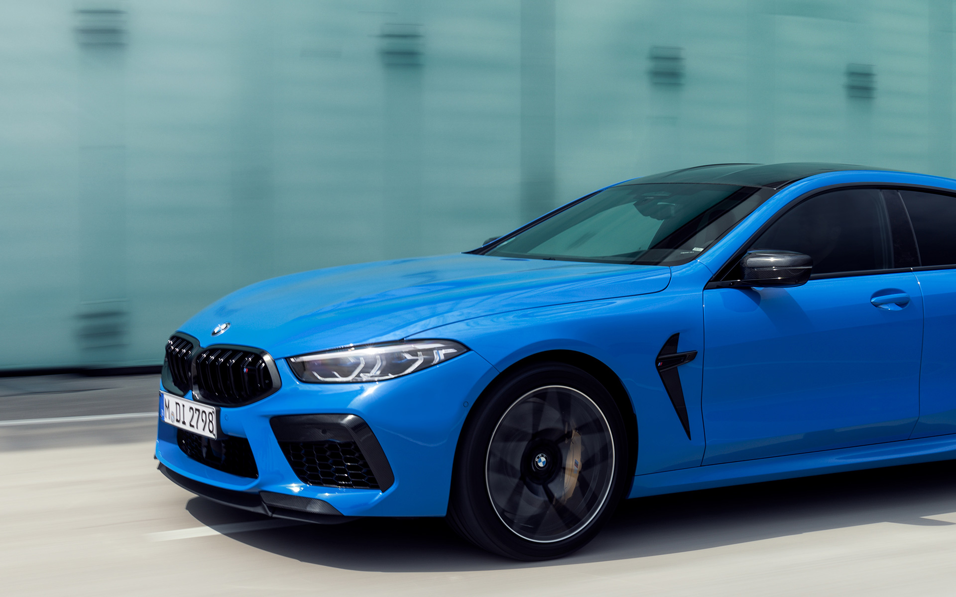 BMW M8 Competition Coupé F92 2019 BMW Individual Voodoo blue three-quarter side view BMW M8 Competition Coupé F92 2019 BMW Individual Voodoo blue three-quarter side view in section driving