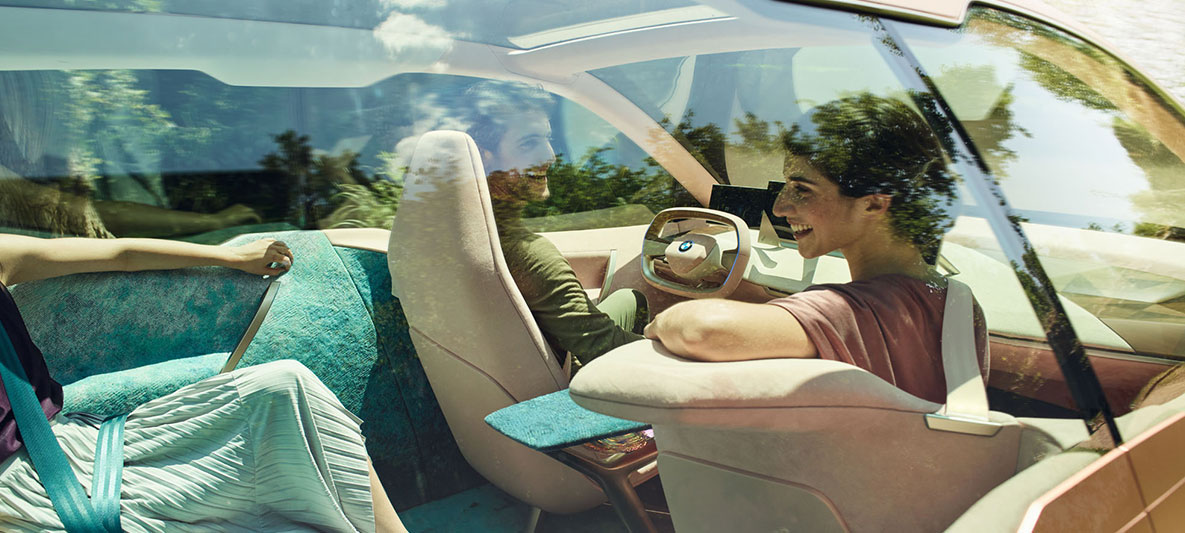 Interior of the BMW Vision iNEXT Interior of the BMW Vision iNEXT with woman, that turns toward the back seat