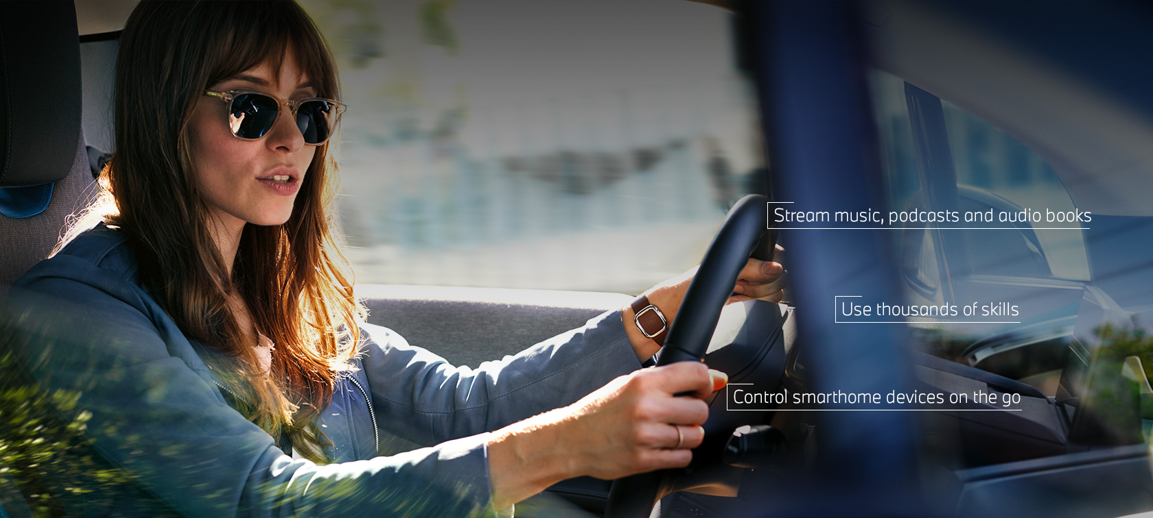 Woman talking to Amazon Alexa while driving in her BMW Woman talking to Amazon Alexa while driving in her BMW
