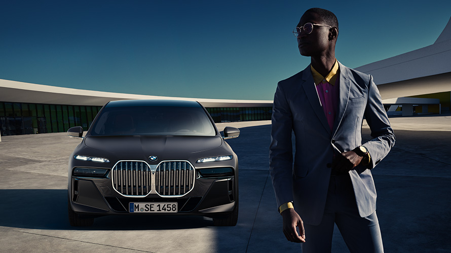 BMW Diplomatic Sales benefits for diplomats Presale Service BMW Diplomatic Sales benefits for diplomats Presale Service man in front of BMW diplomatic vehicle