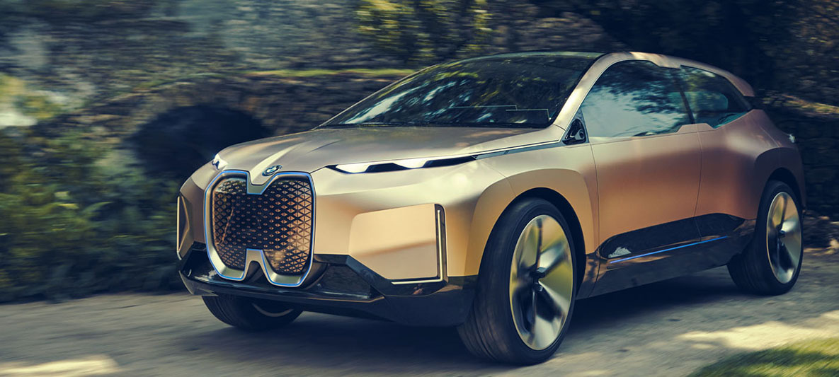 Three-quarter-front shot of the BMW Vision iNEXT in front of wall