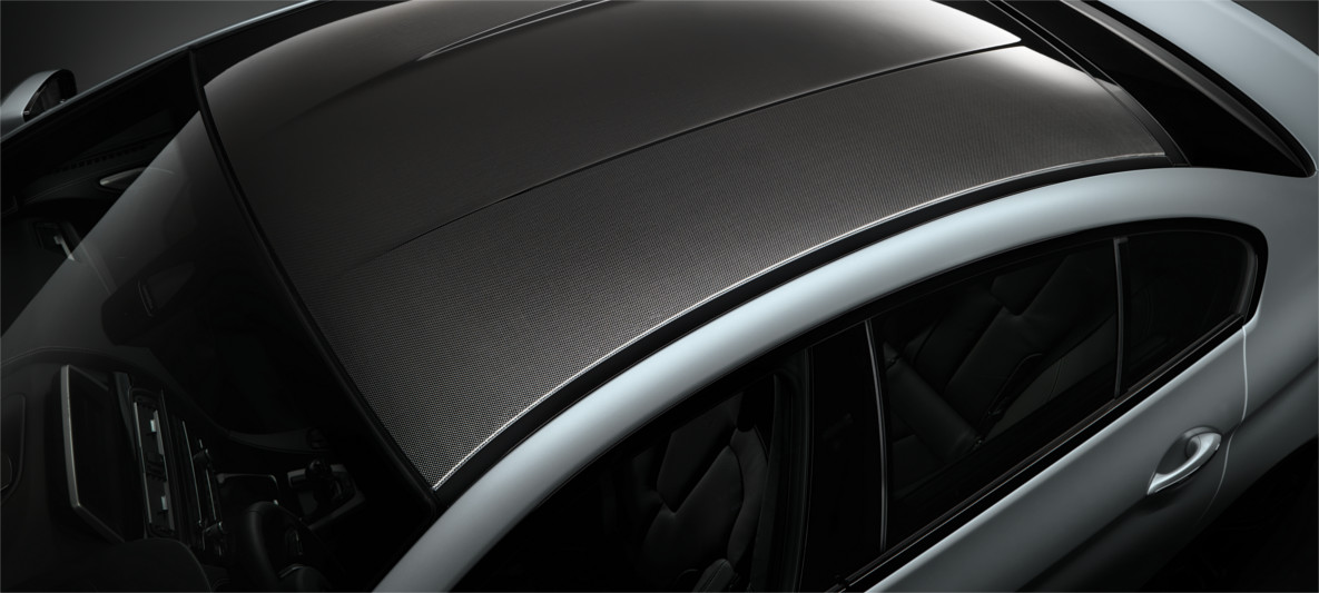 Top view of a BMW M vehicle highlighting its carbon fiber roof design, showcasing aerodynamic efficiency and lightweight construction