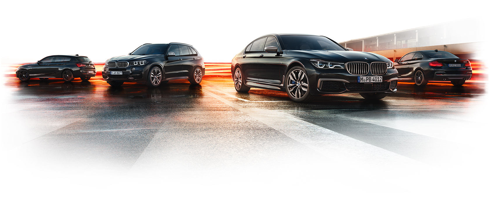 BMW M Performance Lineup – Dynamic Design, Speed, and Precision Engineering Lineup of BMW M Performance models on wet asphalt with light trails showcasing speed and luxury