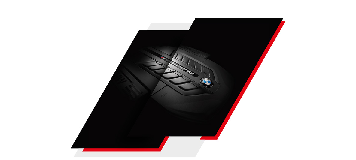 BMW M Performance Engine – Precision Engineering and High-Performance Design Close-up of BMW M Performance engine cover showcasing powertrain design and branding